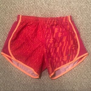Orange and pink Nike printed girl’s running shorts